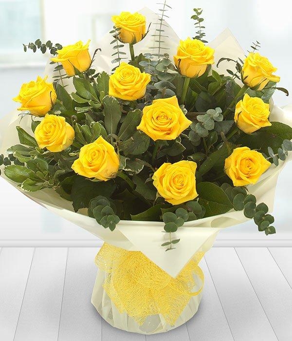 A Dozen Yellow Roses in a vase